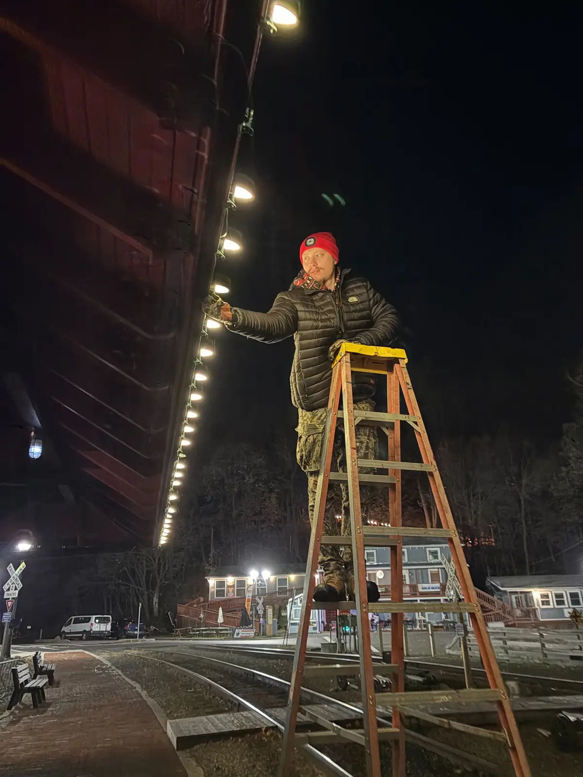 Crew installing bistro lighting at the rail site