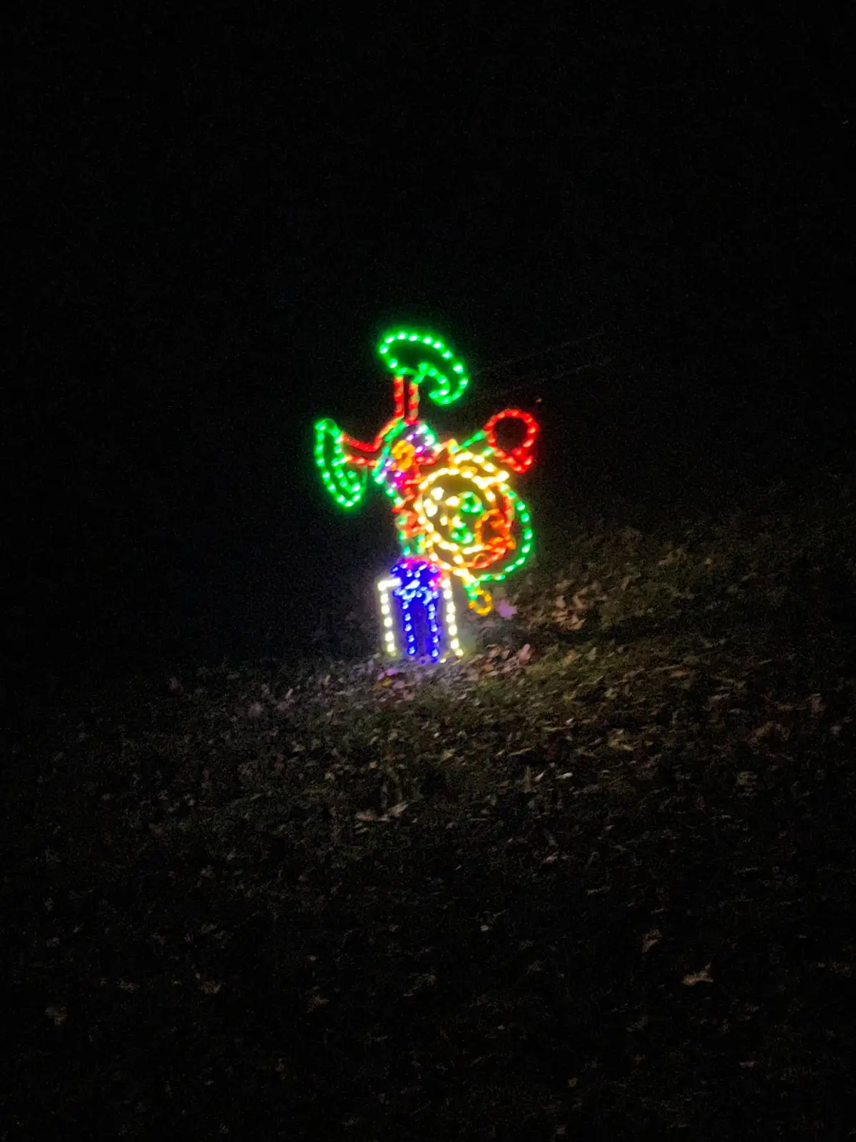 Elf wireframe light figure beside the rail line